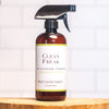 Peppermint Vanilla All Purpose Cleaner bottle on wooden plate, safe natural cleaner for everyday use.

