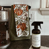 Peppemrint Vanilla All Purpose Cleaner bottle on kitchen counter, safe natural cleaner for everyday use.