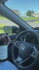 Woman spraying car steering wheel with Clove Cinnamon Vanilla safe ,natural cleaner for everyday use.