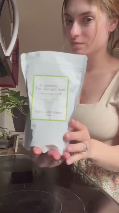 video of woman using Red's Gone Green All Purpose scrub and spray cleaner to clean her stovetop