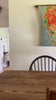 Video of mom spraying Lavender Vanilla Cleaner on sealed wooden table top, safe and effective natural all-purpose cleaner.