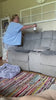 Video of woman spraying couch with Peppermint Vanilla all natural cleaner, aromatherapy fabric and air refresher.