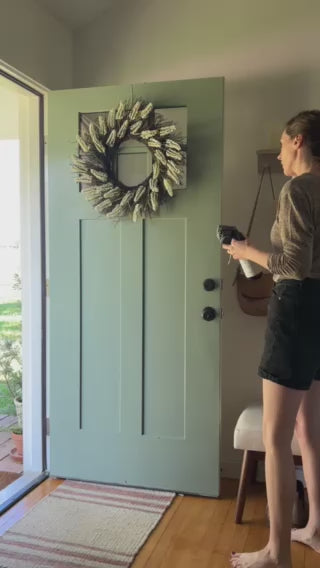 Video of mom spraying Peppermint Vanilla Cleaner on front door, safe and effective natural all-purpose cleaner that smells amazing.