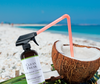Coconut Vanilla All Purpose Cleaner drinking from a coconut
